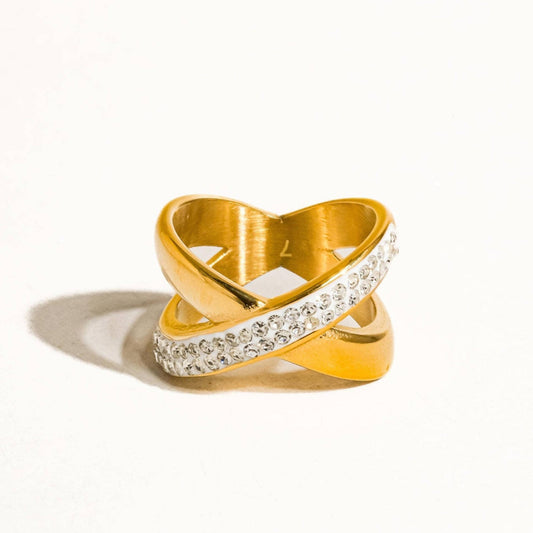 Gold and crystal ring on a white background