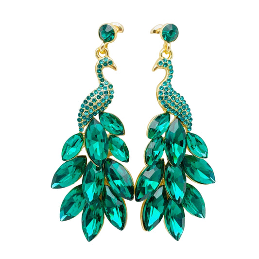 Pair of green peacock-shaped earrings on a white background